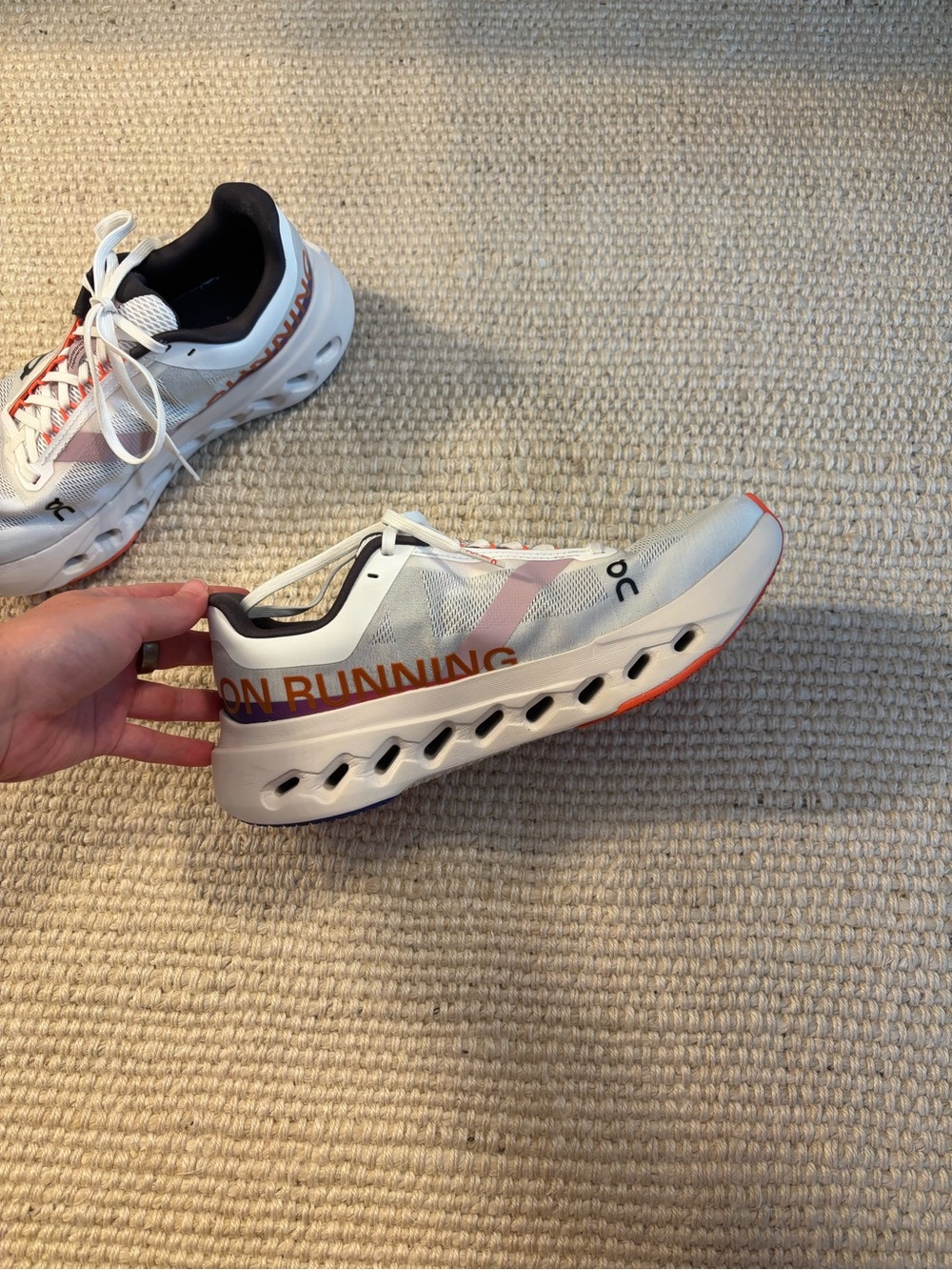 On Running womens Cloudsurfer Next shoes in White with Orange Accents - Picture 4 of 5